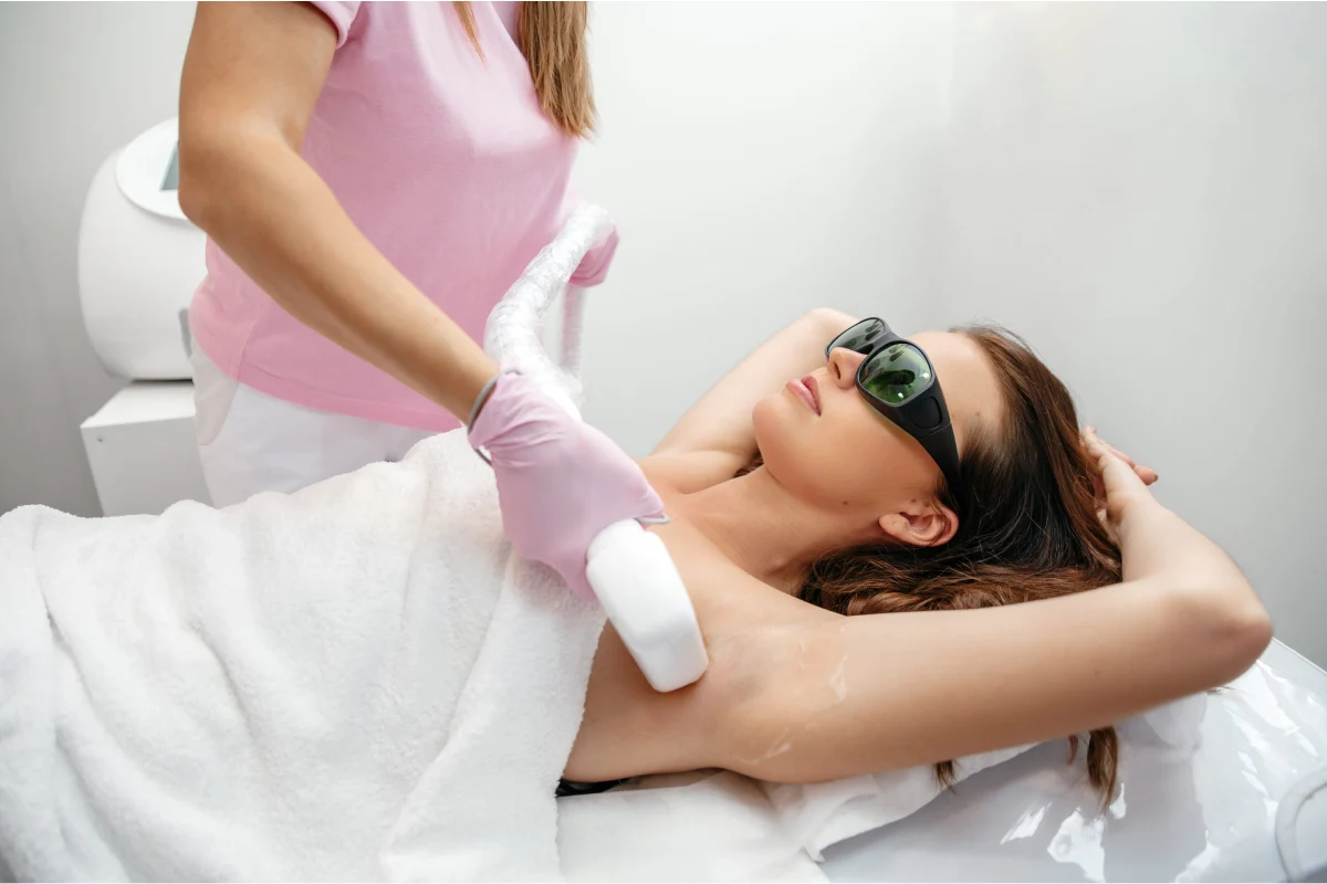 Woman receiving BBL Forever Bare laser hair removal on her underarms in Florence KY by Elle Skin & Beauty Co.